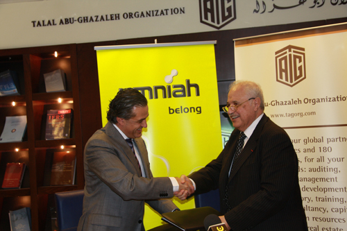 Mr. Talal Abu-Ghazaleh, Chairman and CEO of Talal Abu-Ghazaleh Organization and Mr. Ihab Hinnawi, CEO of Umniah exchange the partnership agreement between Talal Abu-Ghazaleh Knowledge Society and Umniah- April 19, 2010